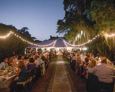 Wedding ceremony at Legare Waring House Avenue of Oaks