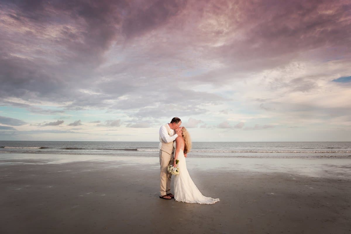 Hilton Head beach wedding ceremony at sunset by Sylvia Schutz Photography
