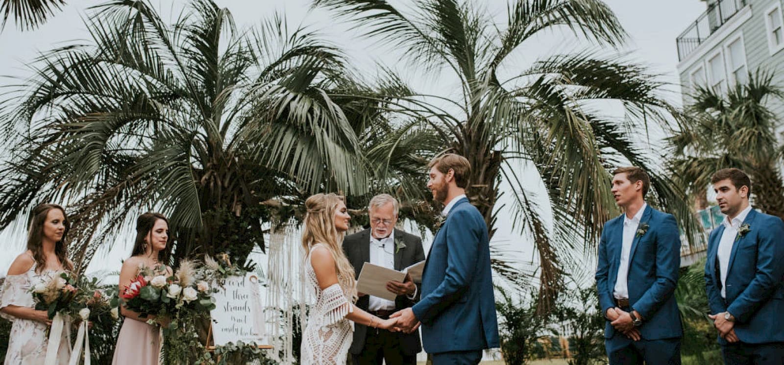 Wedding ceremony under palm trees at Wild Dunes Resort Isle of Palms
