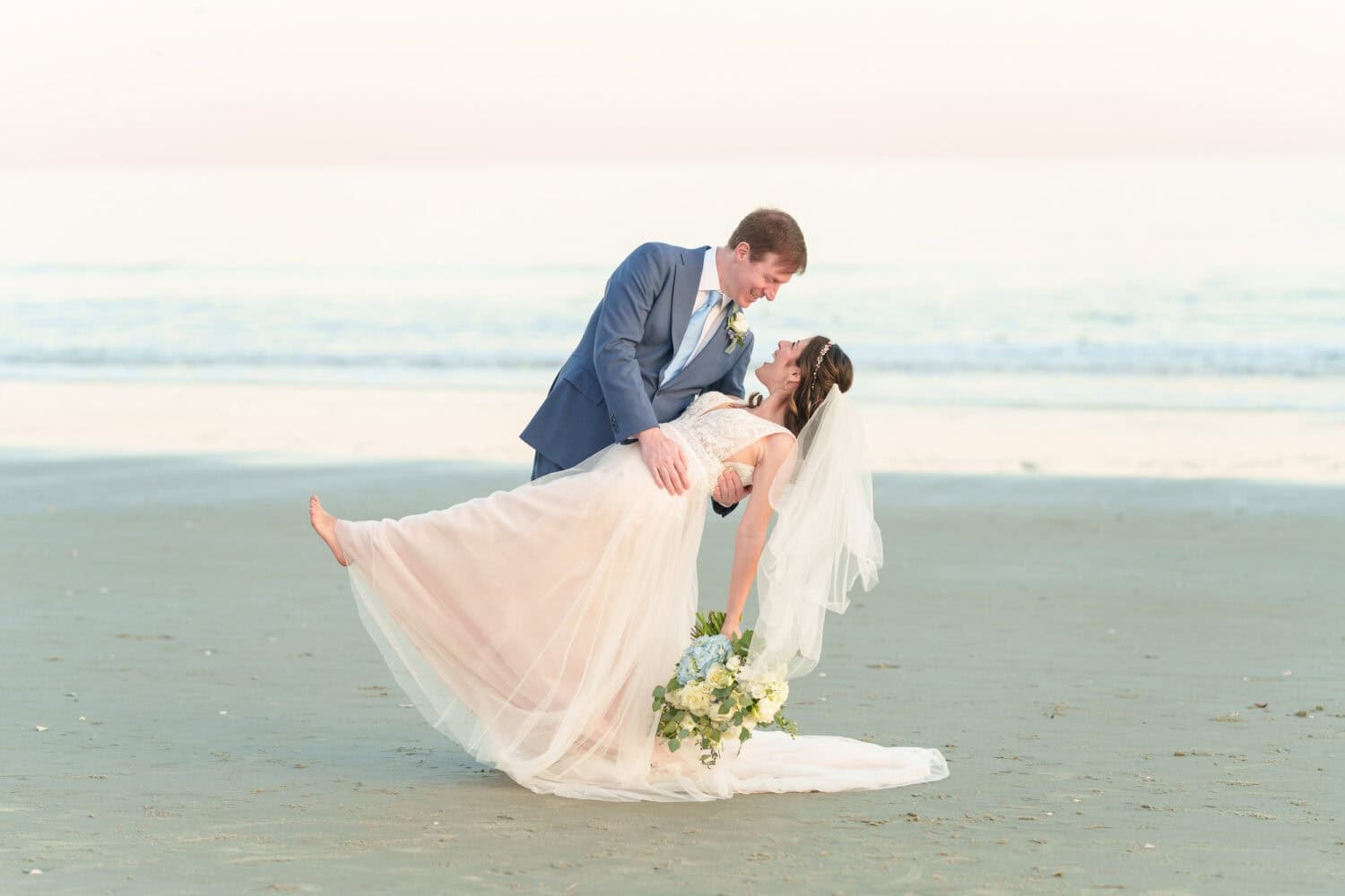 Sunset portraits of bride and groom by the ocean at Marriott Grande Dunes