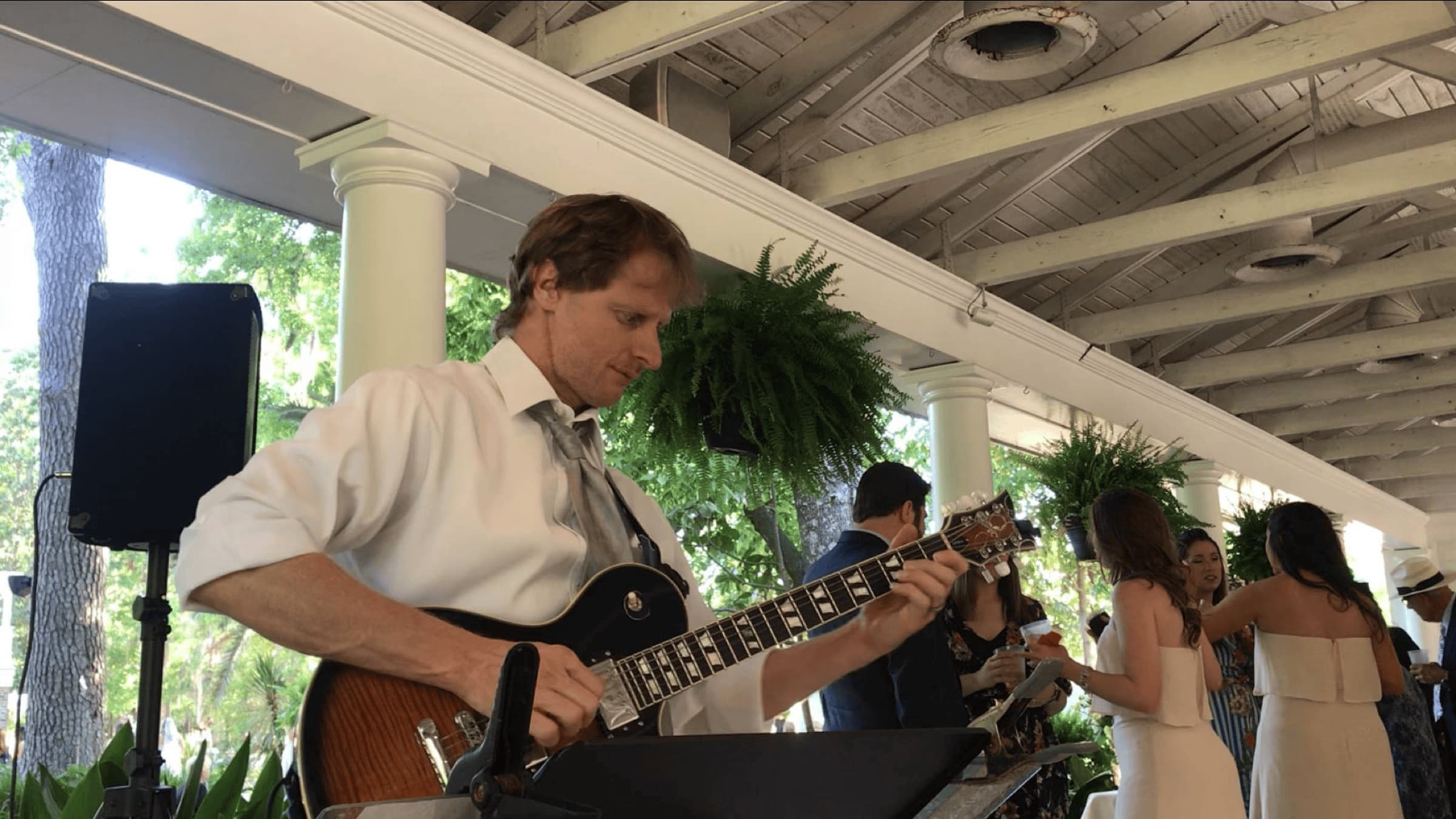 Chris Cavendish - solo guitar on a porch during a wedding