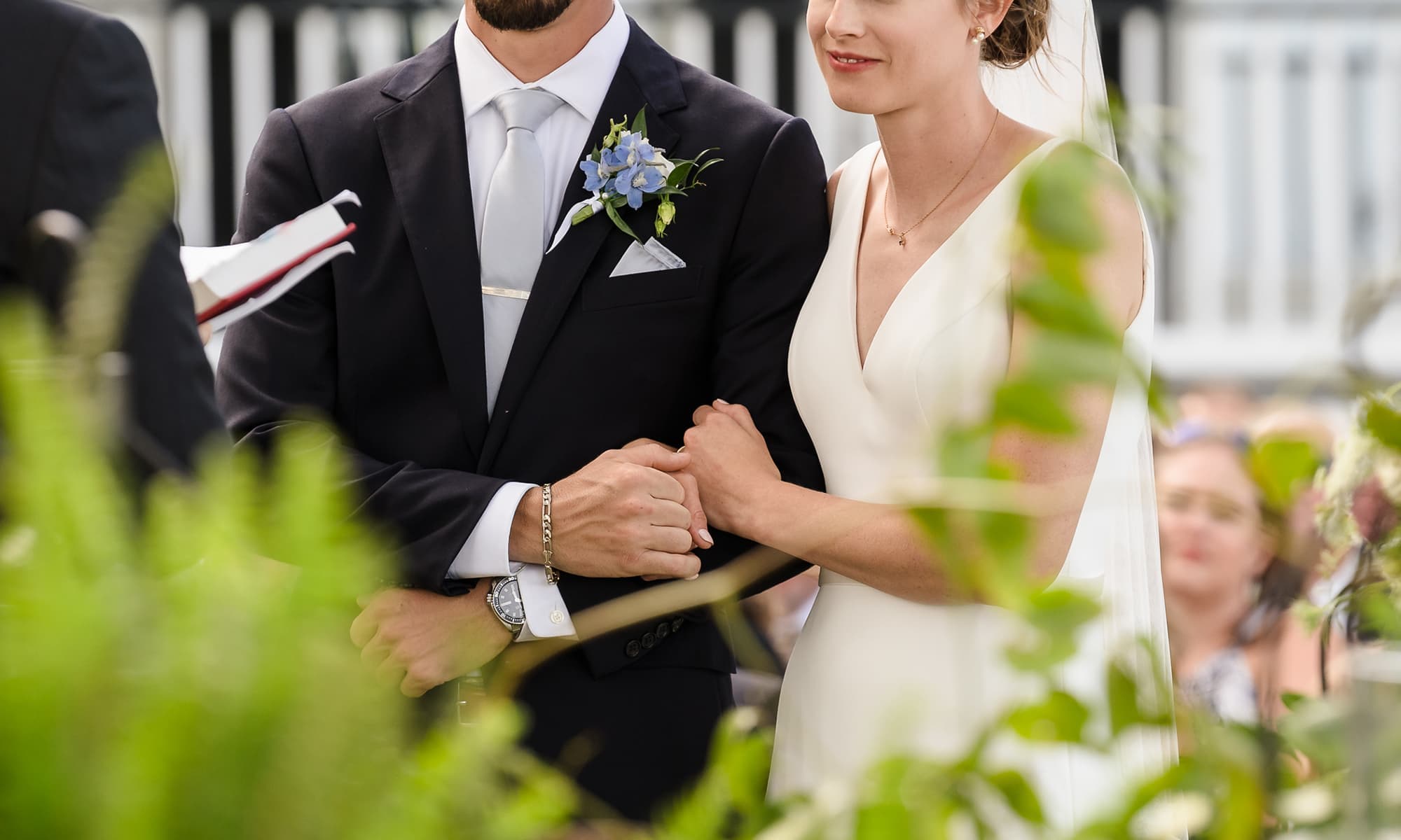 Bride and groom holding hands during outdoor ceremony in Beaufort SC